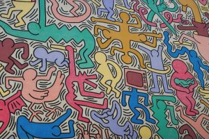 Keith Haring: About Art. Dalla mostra milanese allo speciale rapporto dell'artista con Pisa, città di Tuttomondo, il murales più grande d'Europa.